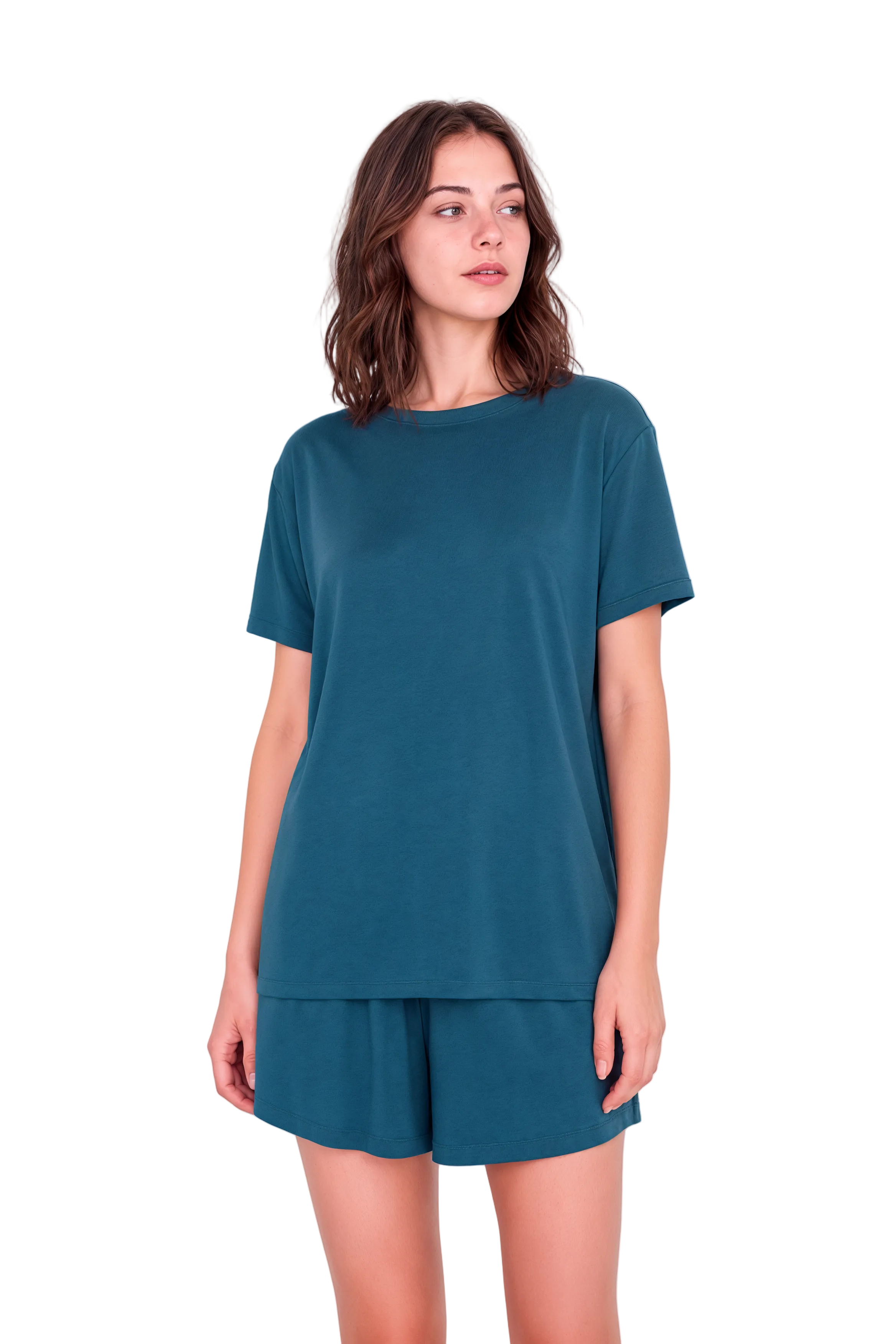 A woman modeling a matching teal short-sleeve t-shirt and shorts lounge set against a solid pale pink background.