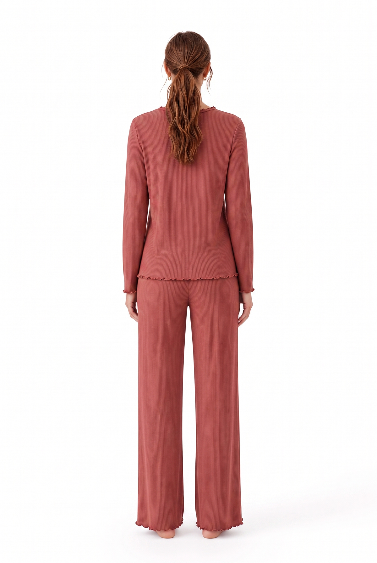 A woman viewed from the back wearing a matching dusty rose long-sleeve top and wide-leg pants set, photographed against a clean white studio background.