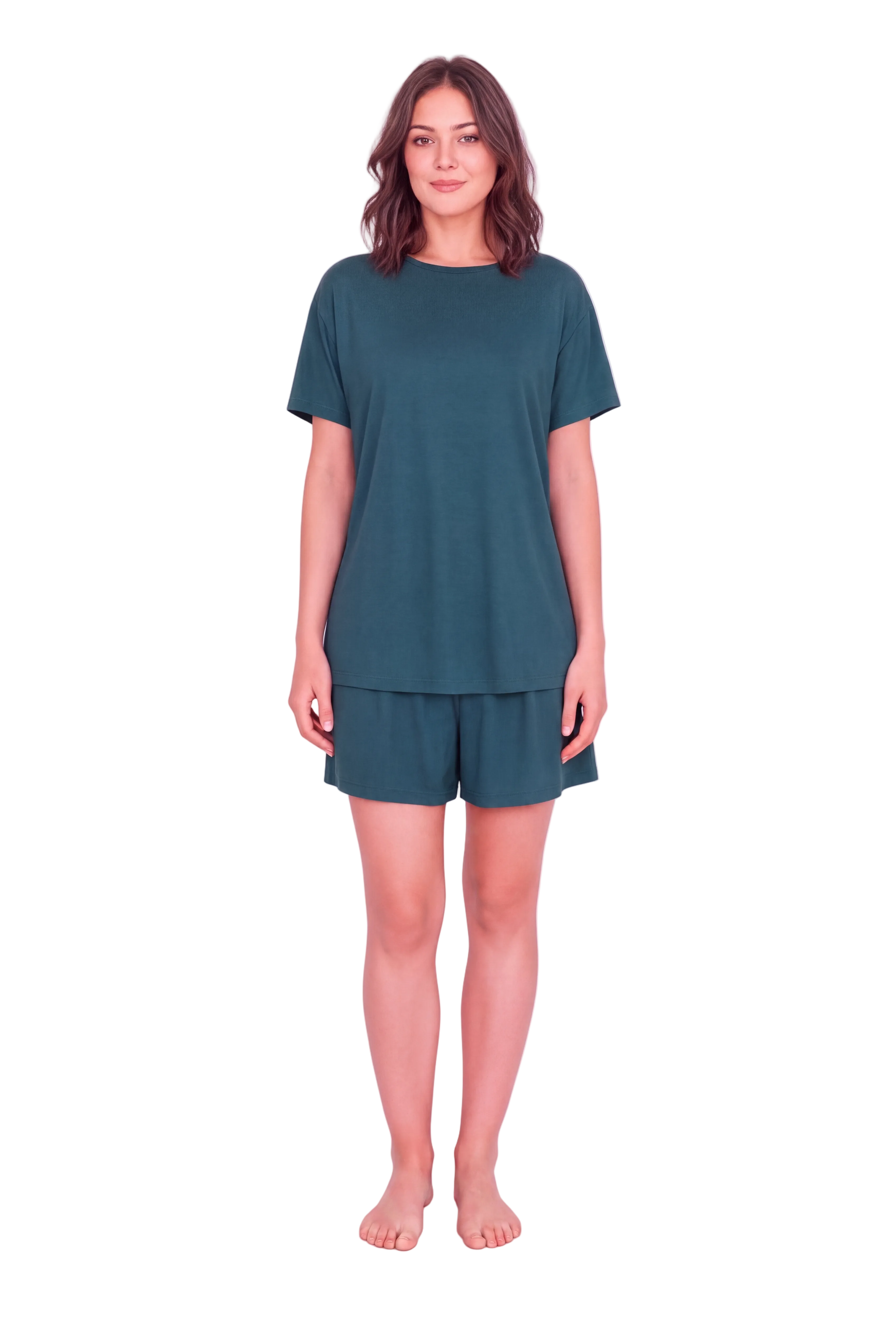 A woman modeling a matching two-piece lounge set consisting of a short-sleeve crewneck top and coordinating shorts in a dark teal green color, set against a solid light pink studio background.